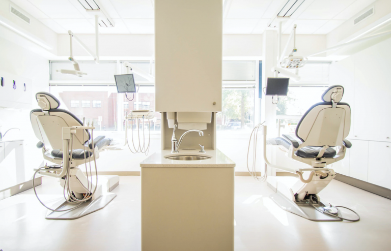 UBCS | A dental office in Canada featuring two chairs and a sink, designed for patient comfort and efficient dental care